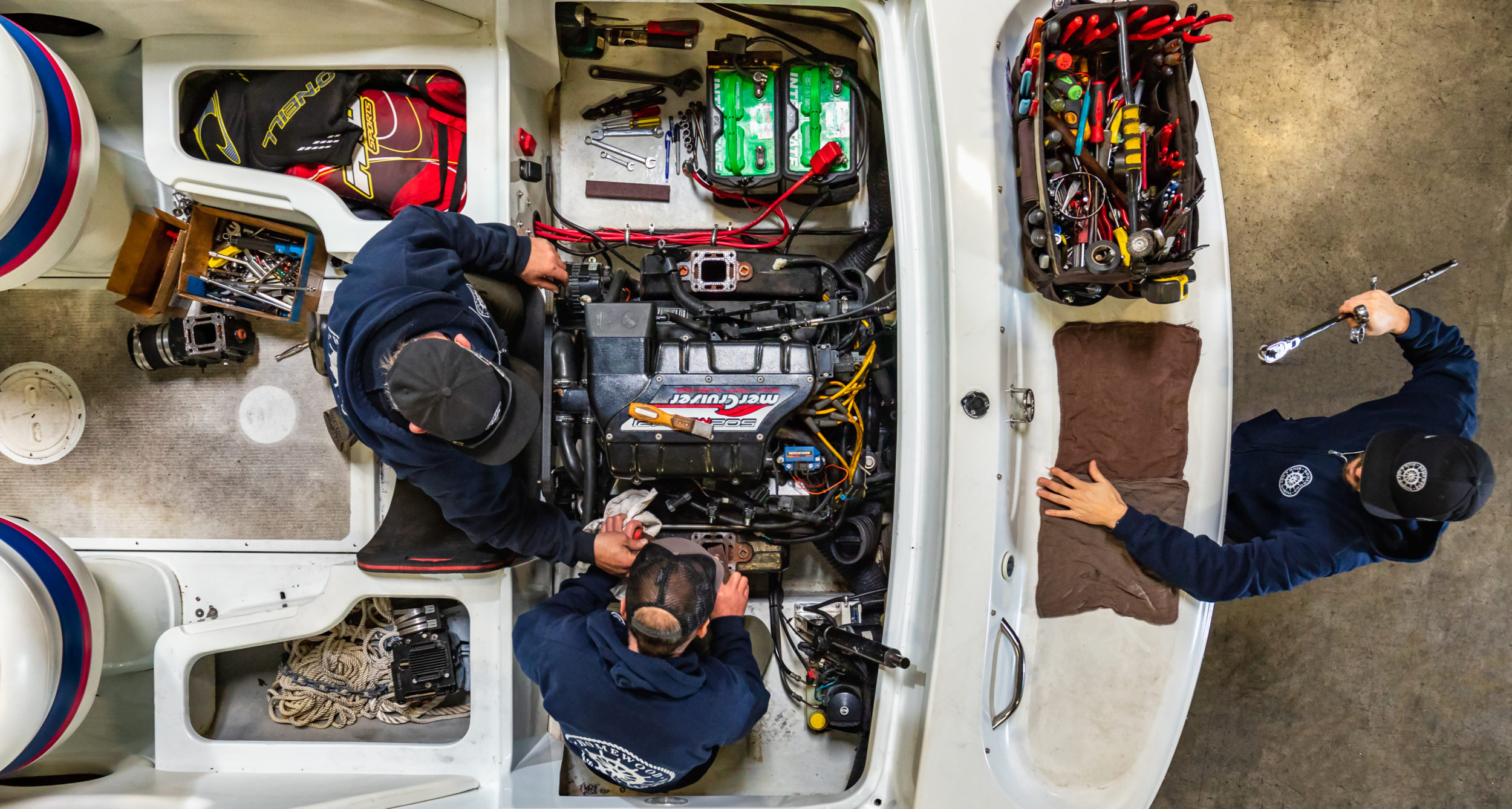 mechanic installing engine in boat at High and Dry Marina